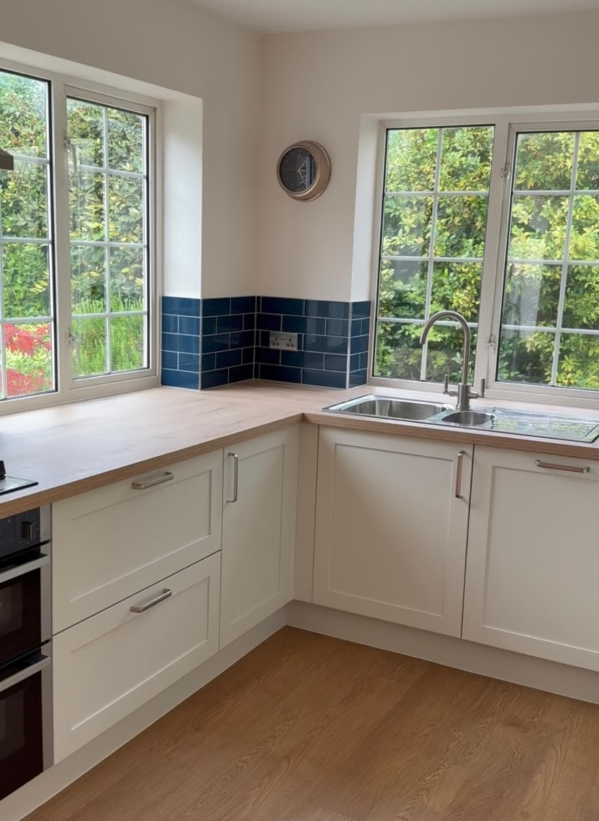 Fitted kitchen with island and timber worktops